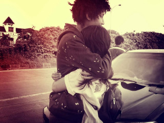 Woman child hug car street - free love wallpaper