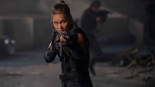 Woman holding gun dark room - other person free wallpaper