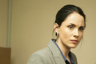 Woman suit earrings serious look 2 - her face and shoulder free wallpaper
