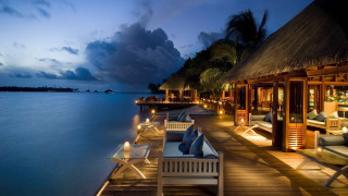 Dock chairs tables night ocean - a restaurant free wallpaper
