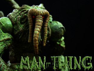 Green creature red eyes black - a green creature free wallpaper