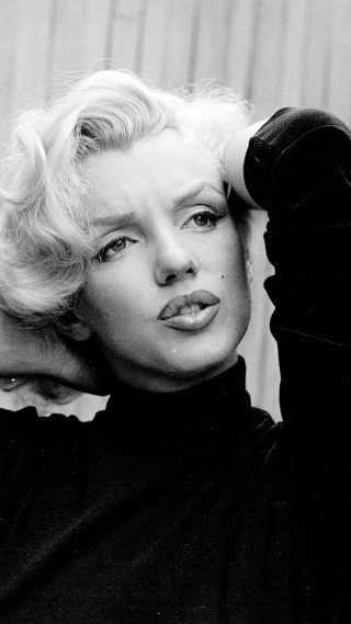 Blonde woman black shirt posing 2 - facial feature free wallpaper