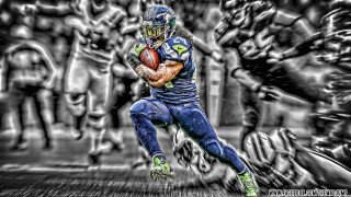 Football player running ball helmet 12 - gritty free wallpaper