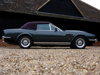 Grey sports car parked building - a black roof free wallpaper