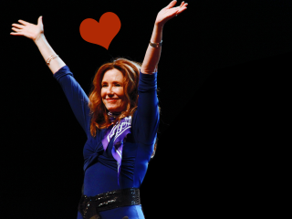 Woman blue top arms up - aileen eagleton free wallpaper