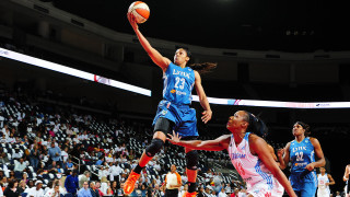 Woman dunk basketball game crowd - a poster free wallpaper