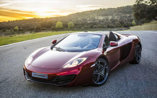 Red sports car hillside sunset - f 8 aperture free wallpaper