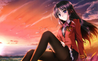 Girl sitting rock sunset clouds - a sunset in the background free wallpaper