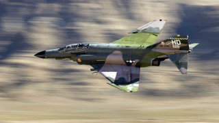 Fighter jet flying mountains clouds - a fighter free wallpaper for desktop