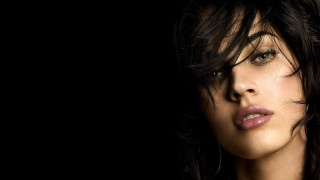 Woman dark hair serious look - free portrait wallpaper for desktop
