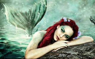 Red haired mermaid sitting beach - dreamlike free wallpaper