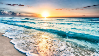 Beach waves sunset people swimming - the sand and a sunset in the background free wallpaper