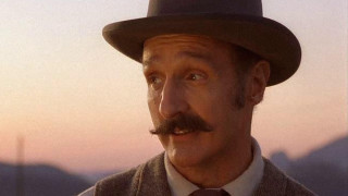 Man mustache hat camera mountain - american realism free wallpaper