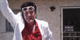 Man white jacket sunglasses waving - eric taylor free wallpaper