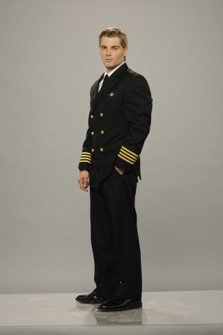 Man black suit gold trim - free portrait wallpaper