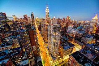 Cityscape tall buildings nighttime lights - ashcan school free wallpaper