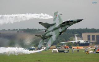 Fighter jet smoking landing gear - back end free wallpaper