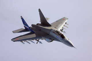 Fighter jet blue sky four - its side free wallpaper