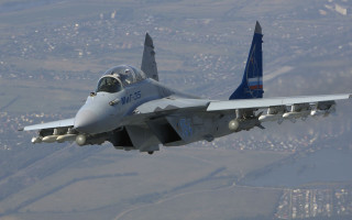 Fighter jet flying air cityscape - blue sky free wallpaper