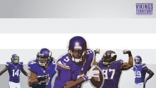 Football players purple uniforms holding - a group of football players free wallpaper