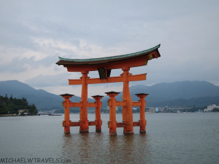 Large orange structure lake mountains - the middle of a lake free wallpaper