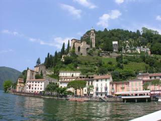 Small town hill castle water - a body of water below free wallpaper