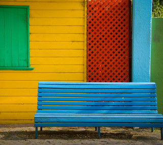 Blue bench yellow building green - a yellow building free wallpaper