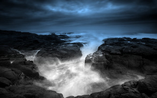 Rocky beach wave crashing water - stormy weather free wallpaper