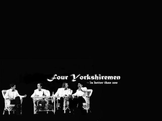 Men sitting chairs black background - a group of men free wallpaper
