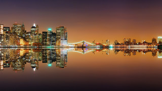 City skyline night reflection water 2 - the water and a bridge in the background free wallpaper