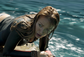 Woman wet suit surfboard water - a wet suit free wallpaper