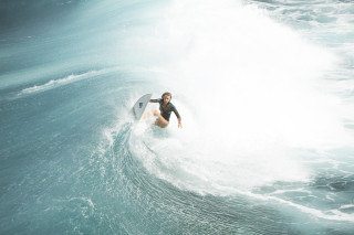 Man riding wave surfboard ocean 38 - top of a surfboard in the ocean free wallpaper