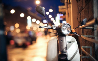 Scooter parked nighttime street lights - coppo di marcovaldo free wallpaper