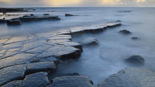 Rocky beach cloudy sky mountains - a cloudy sky above free wallpaper