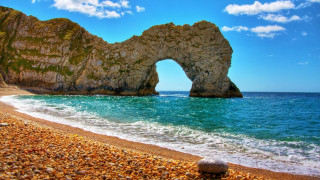 Rock formation beach arch water - a rock formation free wallpaper for desktop