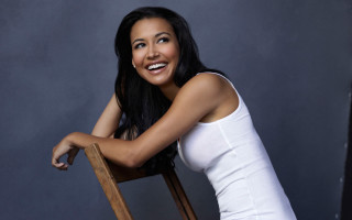 Woman smiling chair arms crossed - fanny mcian free wallpaper