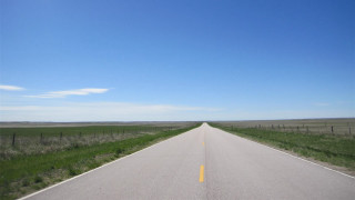 Long straight road fence grass - widescreen free wallpaper