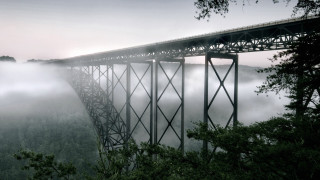 Foggy bridge trees clouds nature - a few tree below free wallpaper