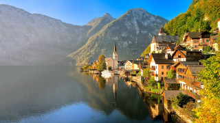 Lake shore houses mountains fog - beautiful landscape free wallpaper
