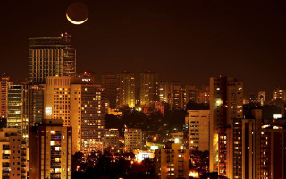 City skyline crescent moon nighttime 2 - a city in the background free wallpaper