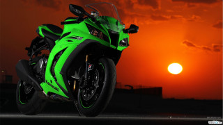 Green motorcycle sunset clouds red - a green motorcycle free wallpaper