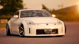 White car parked street sun - rim free wallpaper