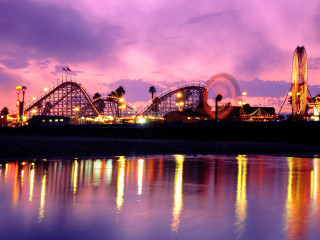 Rollercoaster ferriswheel night reflections cityscape - colorful cloud free wallpaper