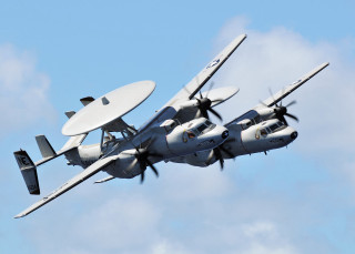 Propeller plane flying blue sky - the front of the plane free wallpaper