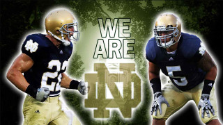 Football players helmets holding football - two football player free wallpaper