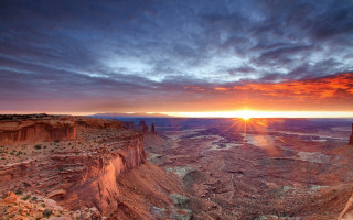 Sunset canyon mountain clouds sky - a sun setting free wallpaper
