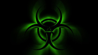 Green biohazard black background glow - biopunk free wallpaper