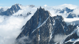 Mountain range snow clouds plane - a mountain range free wallpaper