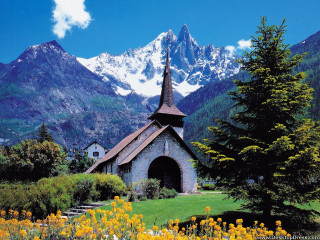 Church mountains yellow flowers snow - mountain in the background free wallpaper