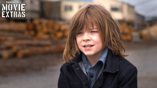 Young boy jacket pile logs - a young boy free wallpaper